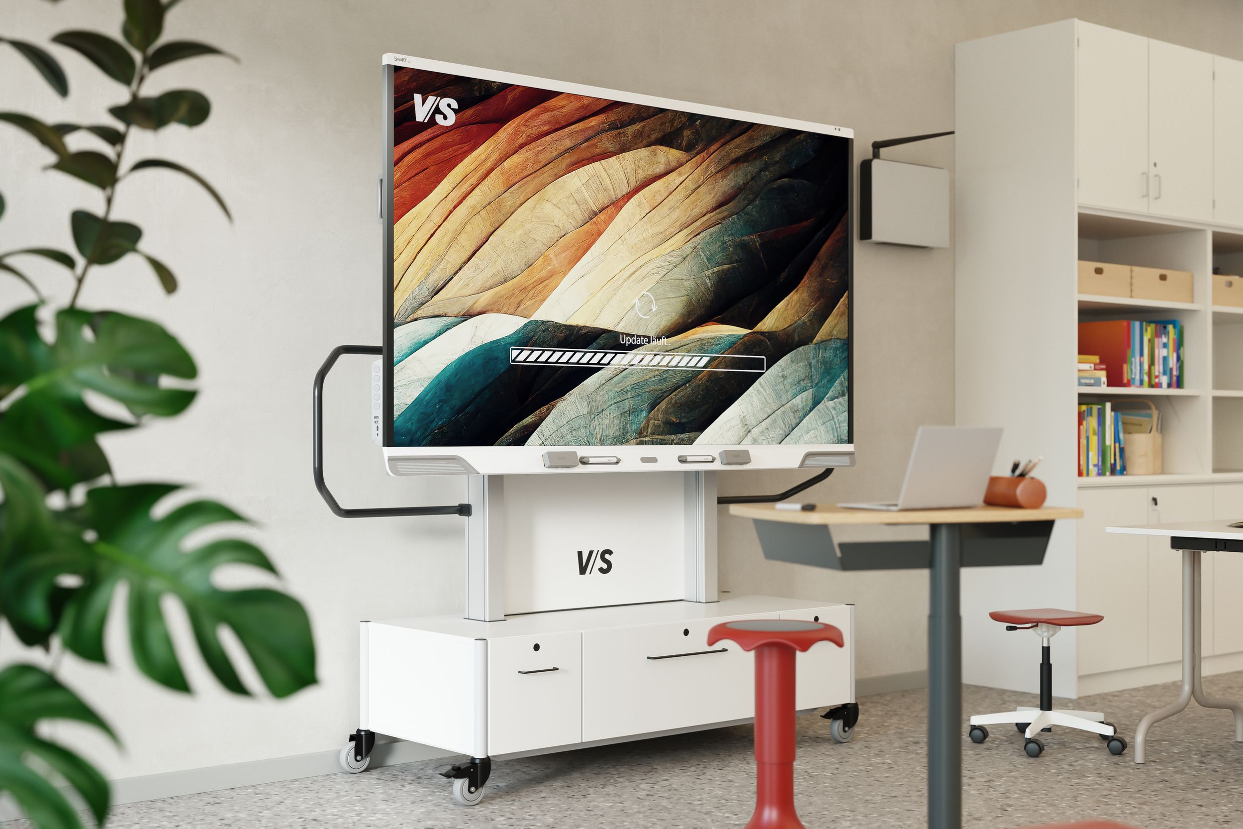 A SMART Board RX mounted on a VS mobile base cabinet displays a progress bar for a software update in progress—next to it are a VS Shift Base table and a VS Hokki stool in red