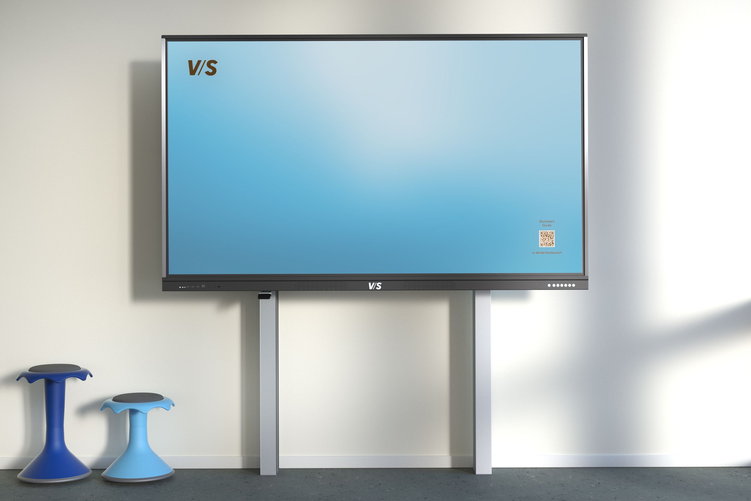 VS Display on a MediaPilon EL mounting system with electric height adjustment—alongside two VS Hokki stools in dark blue and light blue.