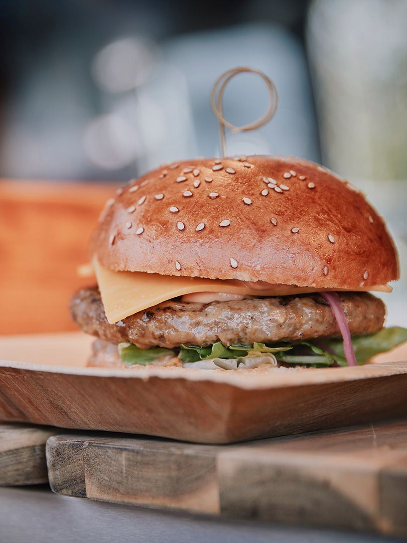 A burger in a wooden bowl at the VS open day