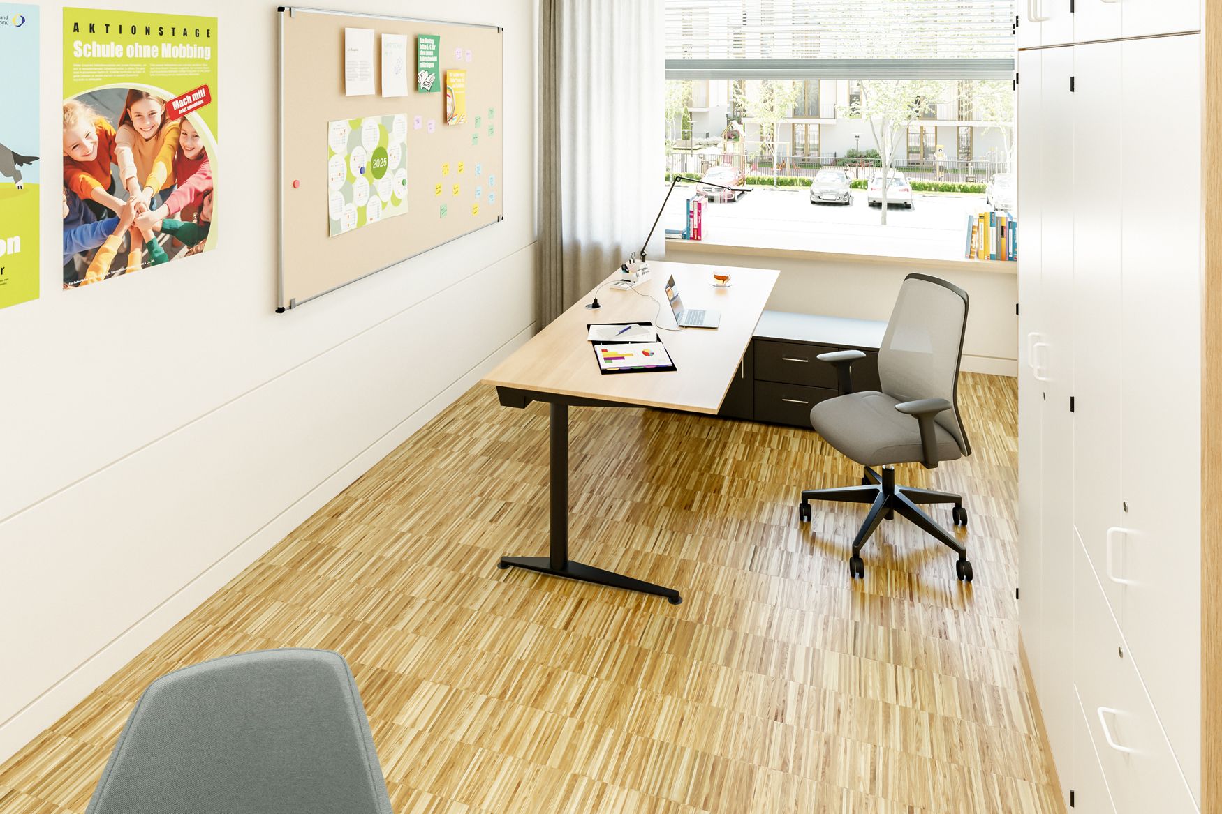 Principal's office featuring a height-adjustable desk, an ergonomic swivel chair, a bulletin board, and Series 800 cabinets from VS