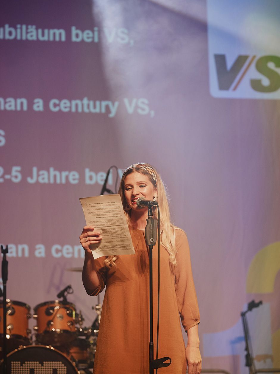 A singer presents a song rewritten for VS at the 125th anniversary celebrations.