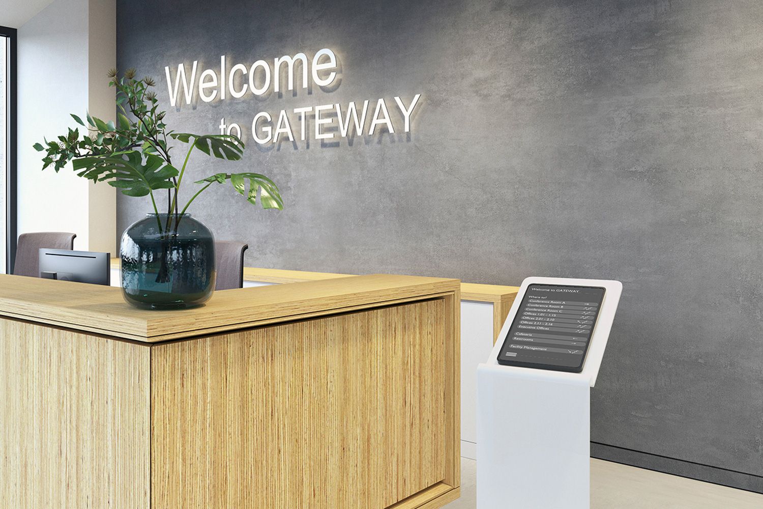 Visitors can register and obtain information at an interactive display next to a reception desk.