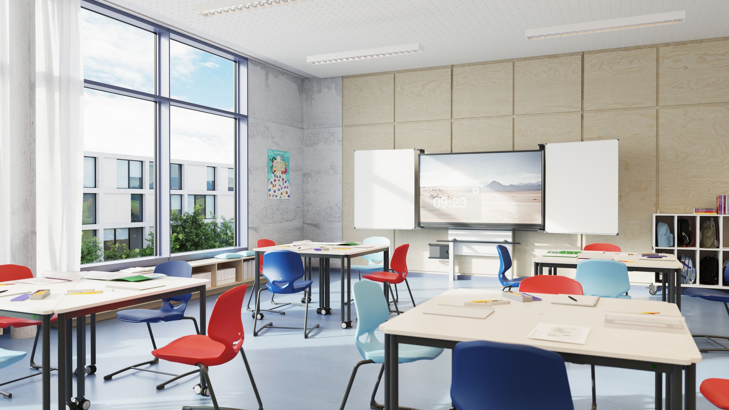 A modern classroom featuring VS Jumper chairs in red, blue, and light blue, VS Triunion desks, a whiteboard, and a VS DUAL display on the wall.