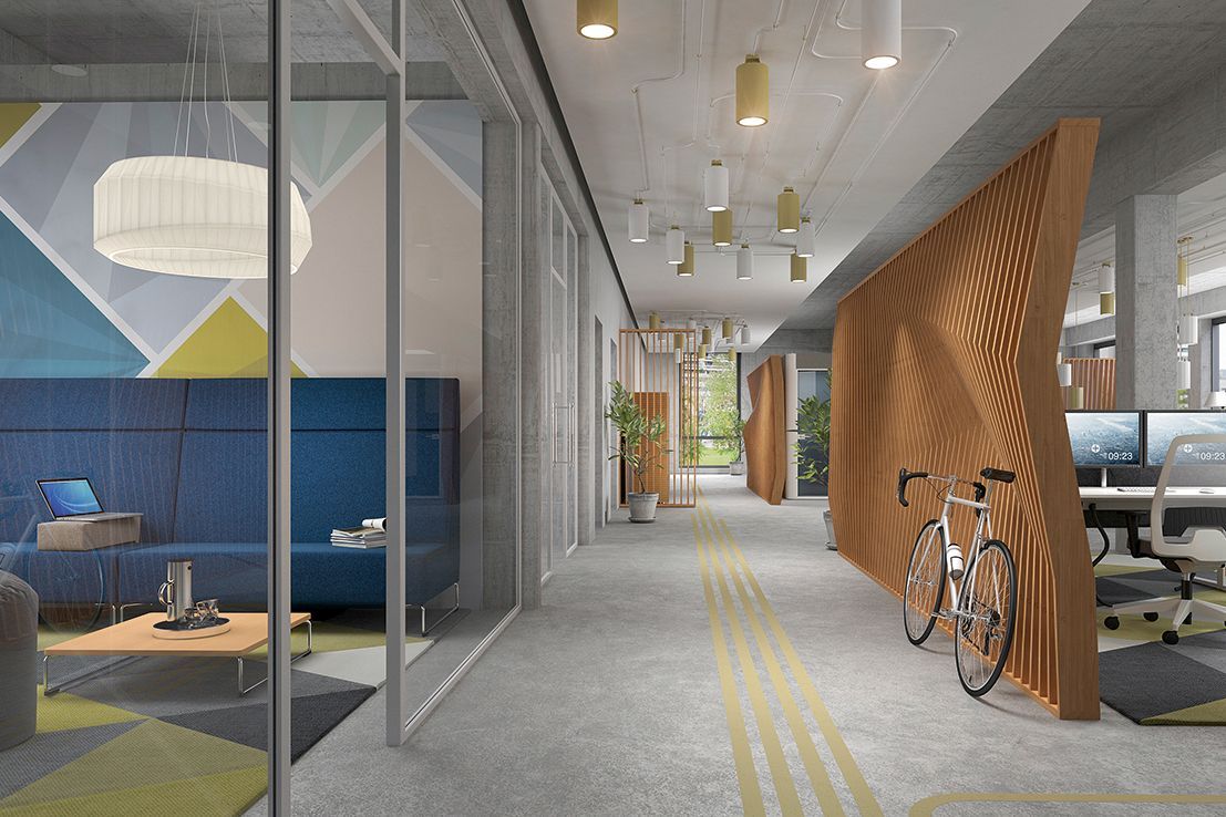 A modern office with comfortable seating in the lounge, sufficient space in the corridor with a parked bicycle and height-adjustable workstations
