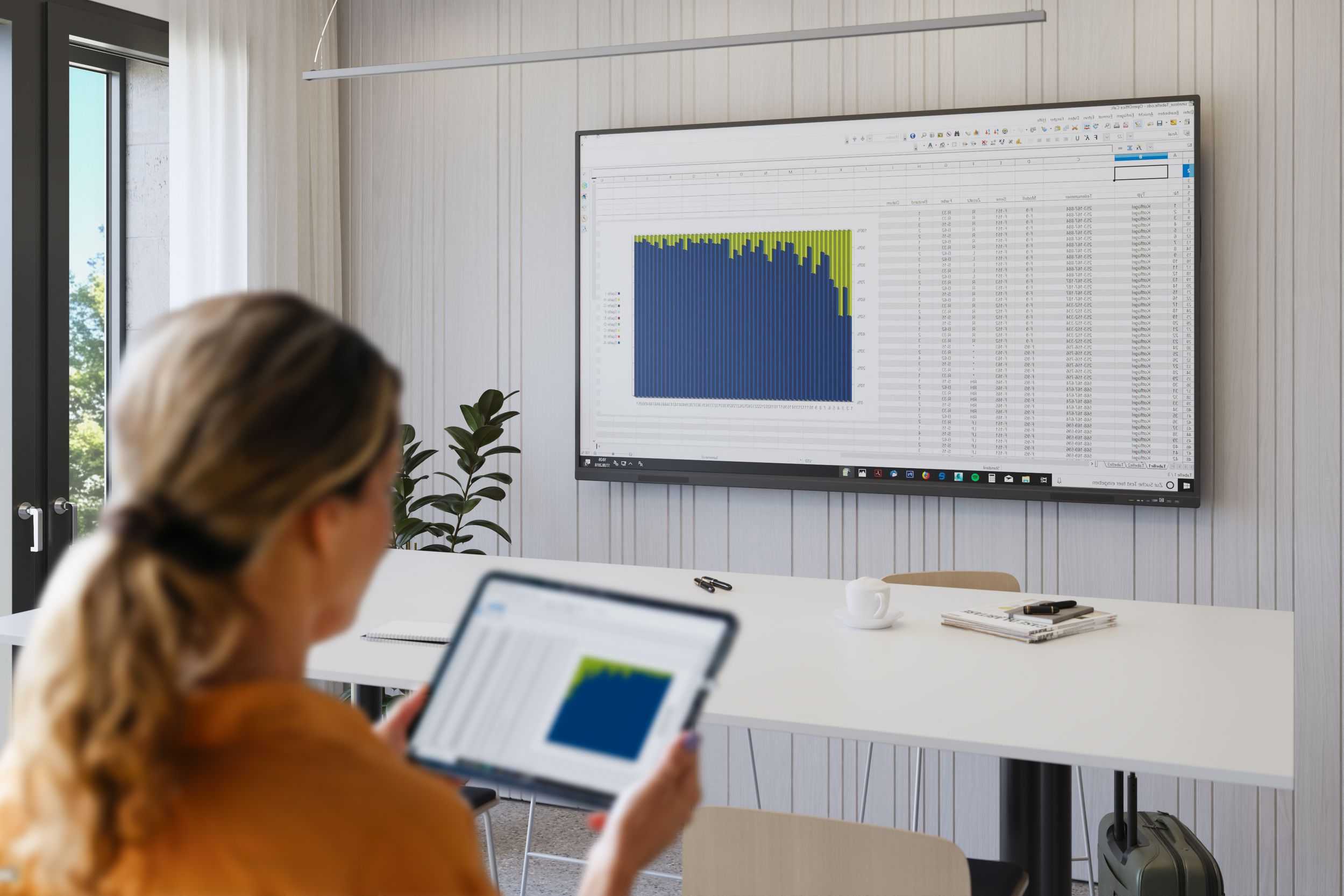 Woman reflects tablet contents on a VS-S-C3 display