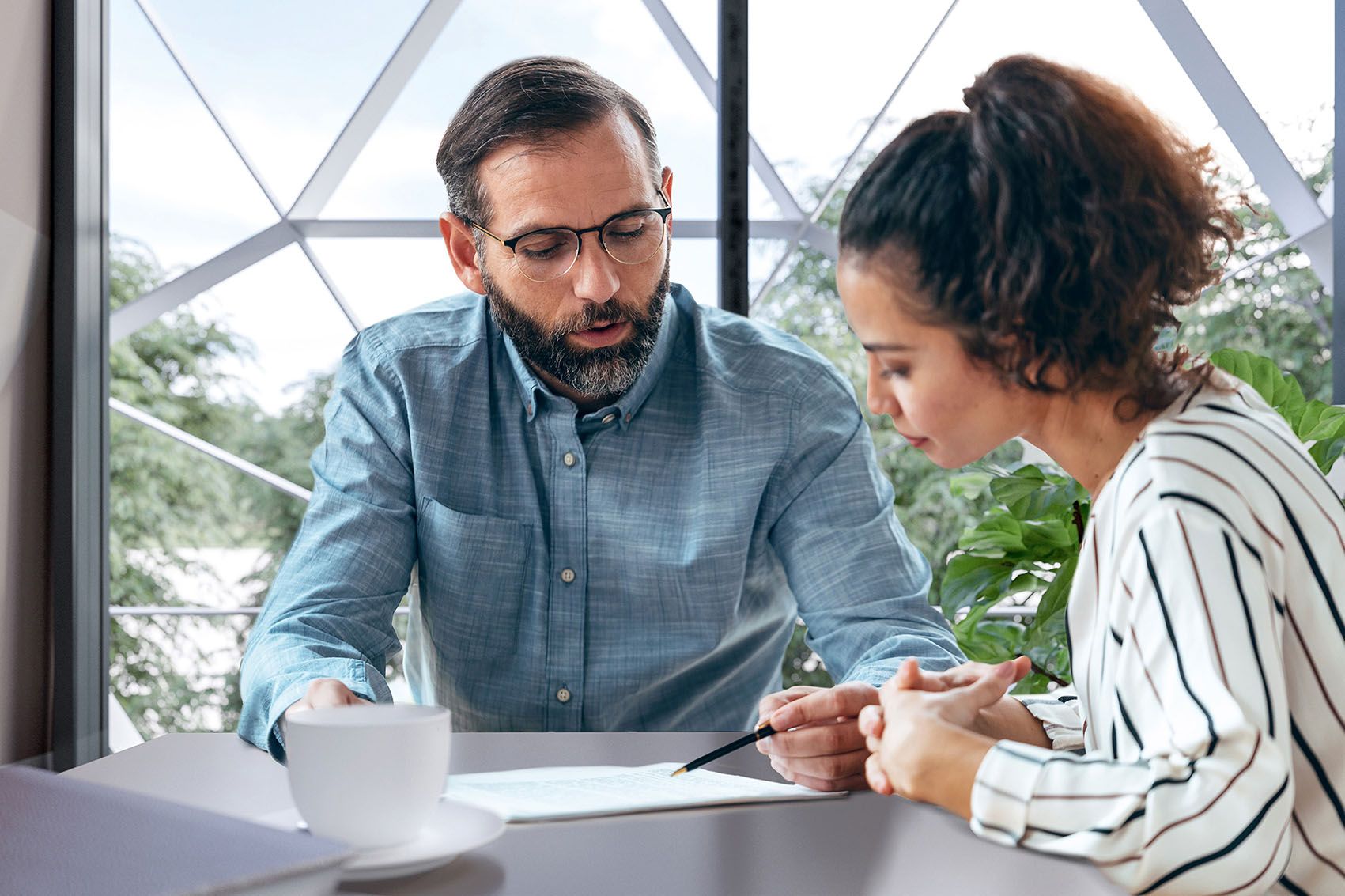A man informs a woman during a consultation meeting
