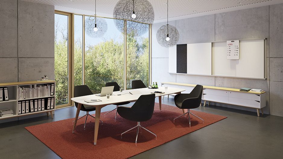 Salle de réunion avec la table de réunion ovale de la série JustBe et les fauteuils rembourrés Fan de VS