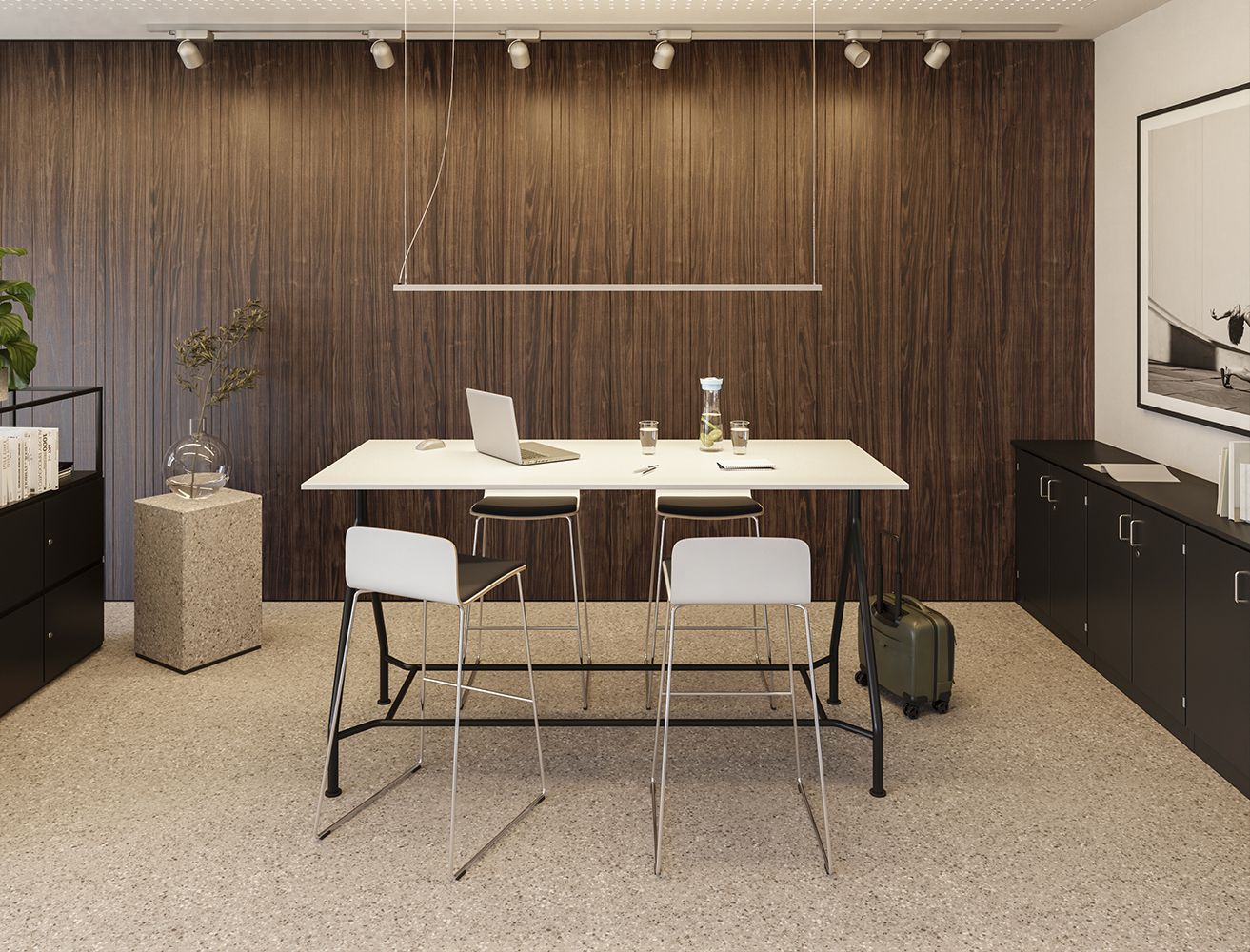 A meeting room featuring an S902 table, four sleek bar stools from the Com series, and black storage units set against a dark wood-paneled wall.