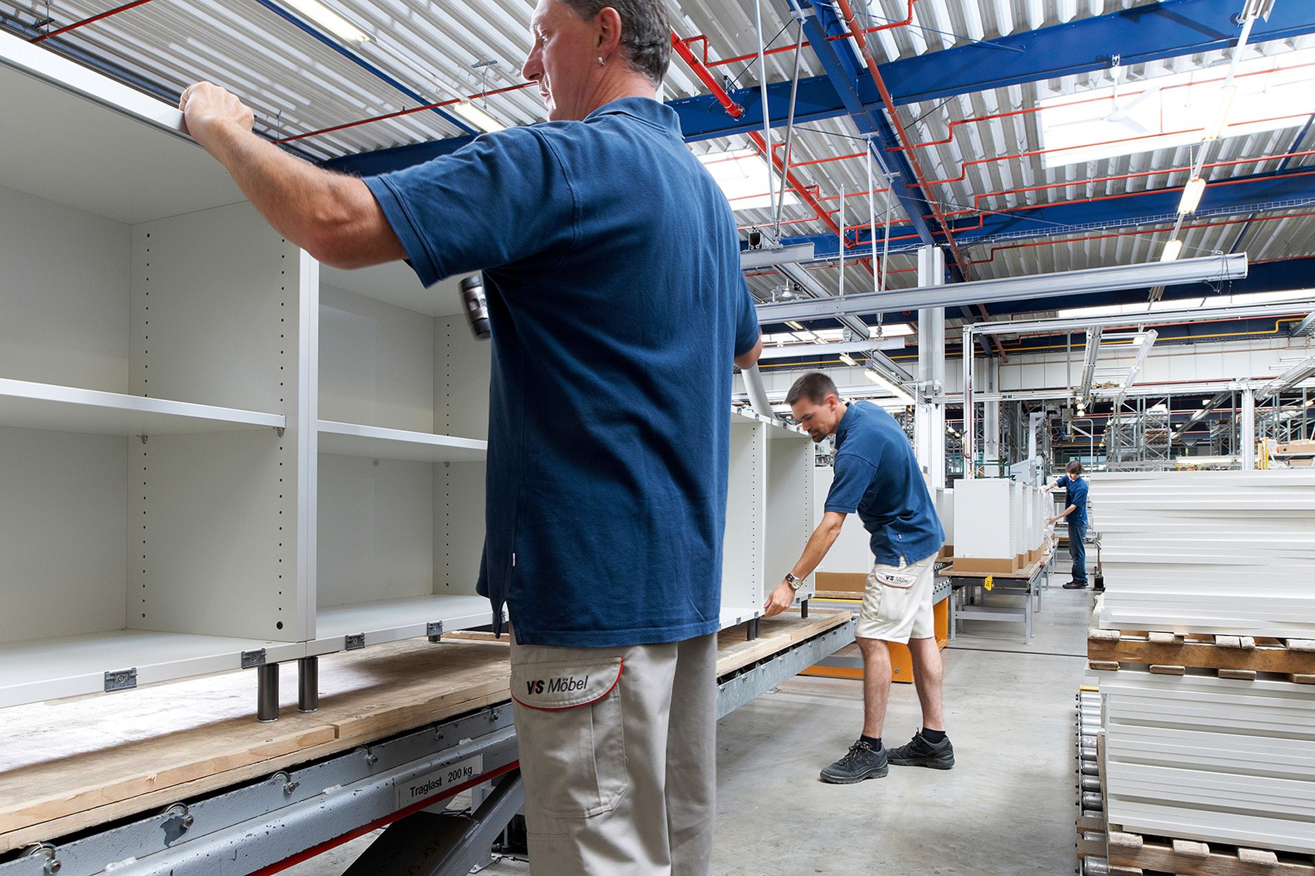 VS employees assemble cabinets in Plant 2