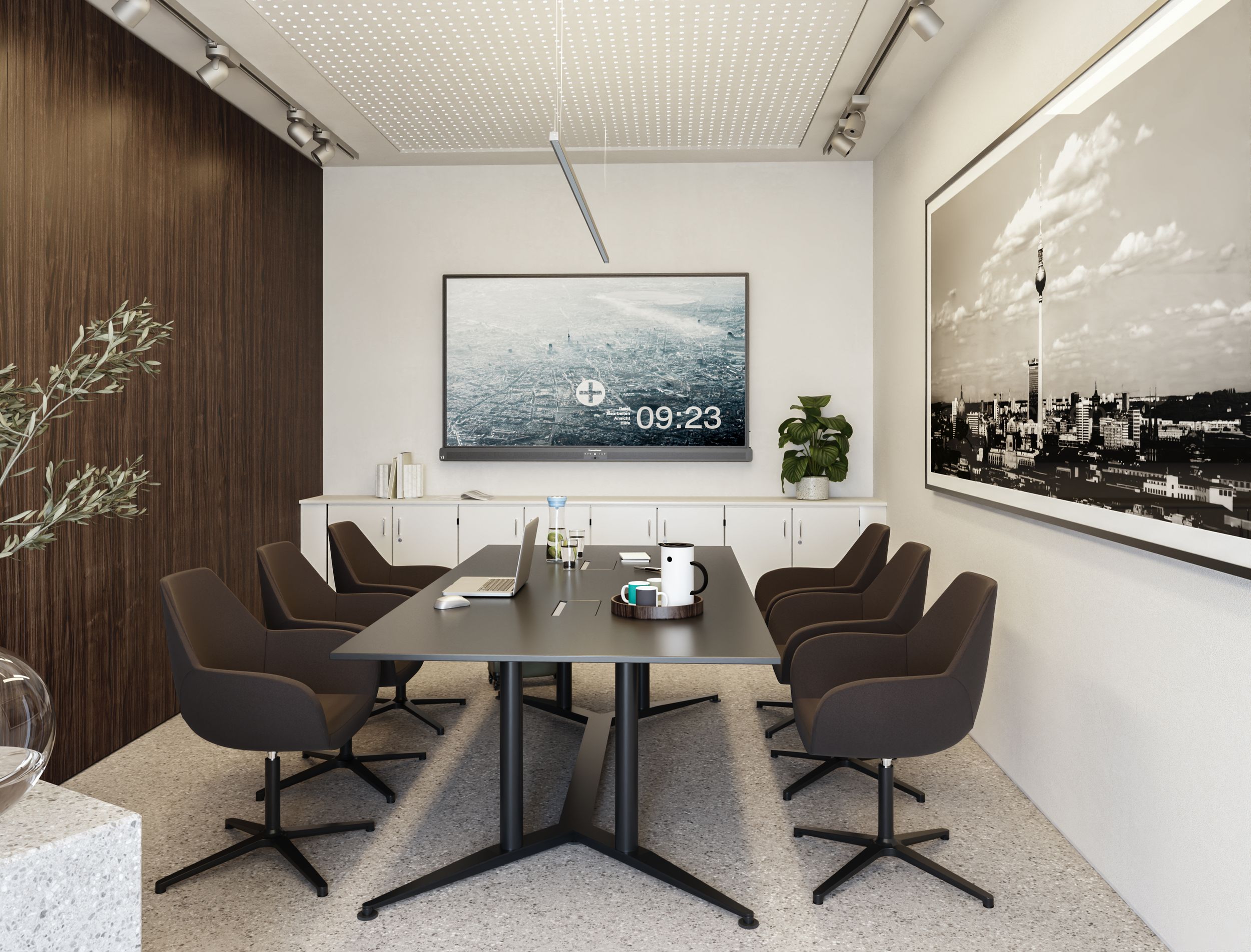An elegant conference room featuring a wall-mounted Promethean ActivPanel 10 Premium and VS Fan chairs in dark brown arranged around a conference table
