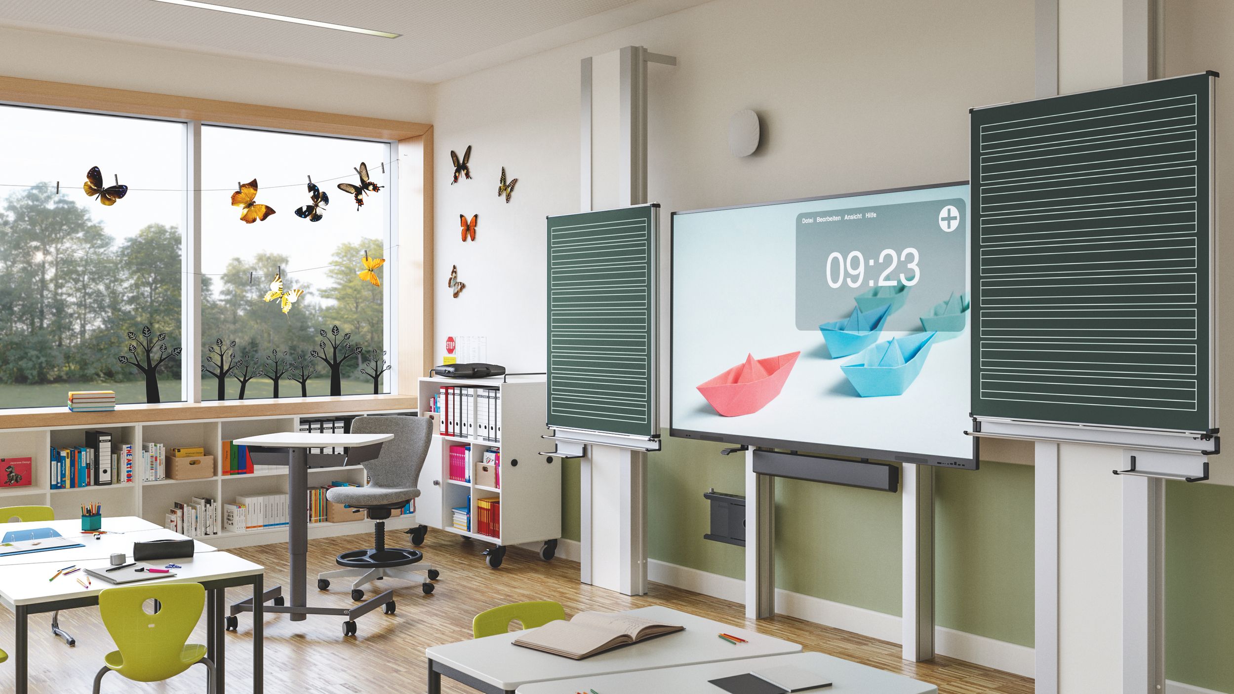 Primary school classroom with blackboards, an interactive display, a height-adjustable teacher’s desk and green pupil chairs from VS