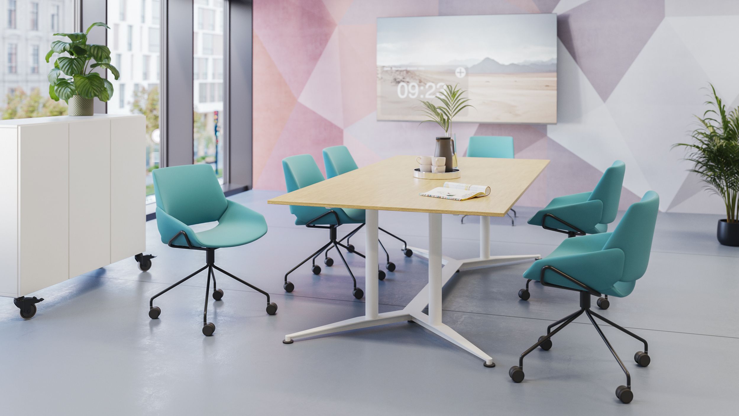 Prostoria Monk wheelchairs in turquoise at the conference table with a display