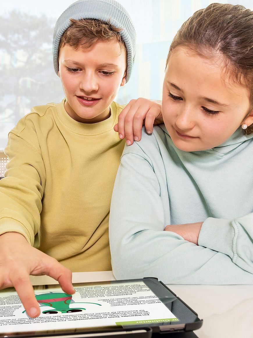 Two children learning together on a tablet